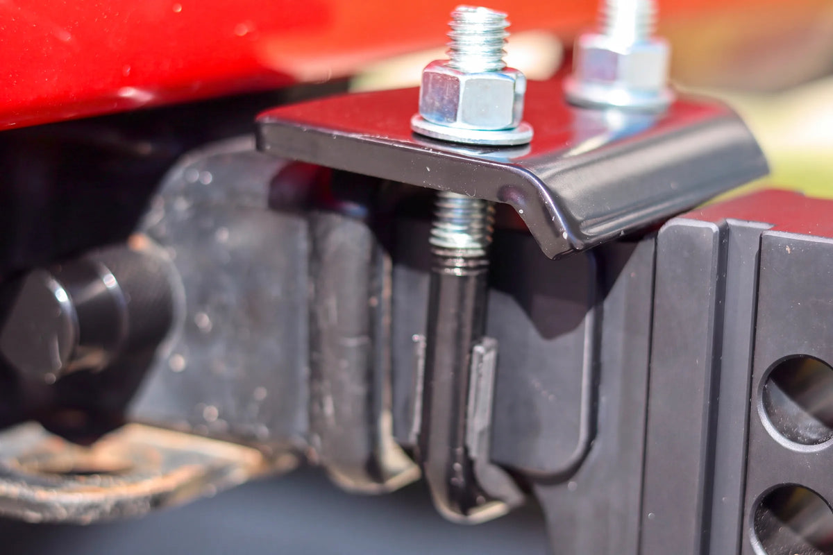 Anti-rattle clamp installed on a YakJak hitch at the receiver