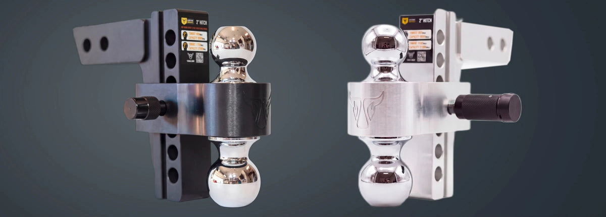 Black and Silver YakJak billet aluminum dual-ball hitches side by side.